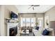 Cozy living room with fireplace and ample natural light at 157 Collared Dove Ct, Summerville, SC 29483