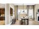Open concept dining area showcasing a spacious table and kitchen view at 157 Collared Dove Ct, Summerville, SC 29483