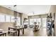 Open living room and dining area with fireplace and access to porch at 157 Collared Dove Ct, Summerville, SC 29483