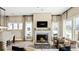 Spacious living room with a fireplace and large windows at 157 Collared Dove Ct, Summerville, SC 29483
