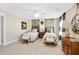 Two twin beds in a well-lit bedroom with carpeted floor and ceiling fan at 166 Collared Dove Ct, Summerville, SC 29483