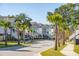 Charming street with houses, palm trees, and a sidewalk at 1659 Cultivation Ln # 454, Mount Pleasant, SC 29466