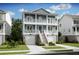 Two-story light blue house with white trim, double garage, and front porch at 1653 Siloh Dr # 490, Mount Pleasant, SC 29466