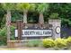 Liberty Hill Farm entrance sign with brick pillars and lighting at 1653 Siloh Dr # 490, Mount Pleasant, SC 29466