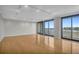 Spacious living room featuring hardwood floors and large windows at 330 Concord St # 5 A, Charleston, SC 29401