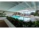 Inviting indoor pool with large windows and lush landscaping at 330 Concord St # 5 A, Charleston, SC 29401