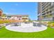 Community patio with seating and artificial turf at 330 Concord St # 5 A, Charleston, SC 29401