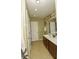 Double vanity bathroom with updated fixtures and tile flooring at 5150 Trump St # 1404, North Charleston, SC 29420