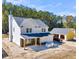 New house and detached garage under construction, viewed from above at 517 Rendezvous Way, Huger, SC 29450