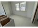 Unfinished bathroom with gray cabinets and tile flooring at 452 Ripple Park Dr, Summerville, SC 29486
