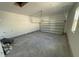Unfinished garage with a new garage door and ample space at 452 Ripple Park Dr, Summerville, SC 29486