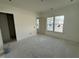Unfinished bedroom with windows and concrete flooring at 452 Ripple Park Dr, Summerville, SC 29486