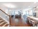 Open living space with hardwood floors, a cozy seating area, and views into the kitchen at 383 Wappoo Trace Ln, Summerville, SC 29486