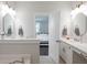 Elegant bathroom with double vanity, quartz countertop and octagon mirrors at 383 Wappoo Trace Ln, Summerville, SC 29486