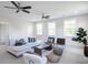 Relaxing living room featuring a sectional sofa and ample natural light at 383 Wappoo Trace Ln, Summerville, SC 29486