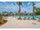 Resort-style pool with lounge chairs and palm trees at 1661 Siloh Dr # 492, Mount Pleasant, SC 29466