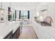Modern kitchen with white cabinets, quartz countertops and large island at 1661 Siloh Dr # 492, Mount Pleasant, SC 29466