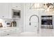 Modern kitchen detail featuring a farmhouse sink and sleek faucet at 1661 Siloh Dr # 492, Mount Pleasant, SC 29466