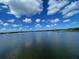 Stunning view of calm water, sailboats, and a bright blue sky at 517 Rendezvous Way, Huger, SC 29450