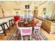 Open concept dining area with a rustic table and seating for six at 8541 Oyster Factory Rd, Edisto Island, SC 29438