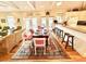 Bright dining room featuring a large table and access to the kitchen at 8541 Oyster Factory Rd, Edisto Island, SC 29438