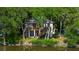Elevated home on waterfront property with lush green surroundings at 8541 Oyster Factory Rd, Edisto Island, SC 29438