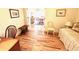 Bright guest room with hardwood floors and built-in daybed at 8541 Oyster Factory Rd, Edisto Island, SC 29438