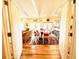 Open dining room with hardwood floors and access to the living room at 8541 Oyster Factory Rd, Edisto Island, SC 29438