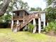 Two-story home with screened porch and spacious deck at 8541 Oyster Factory Rd, Edisto Island, SC 29438