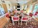 Open concept dining area with a rustic table and seating for six at 8541 Oyster Factory Rd, Edisto Island, SC 29438