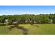 House nestled in the trees with a view of the marsh at 8541 Oyster Factory Rd, Edisto Island, SC 29438