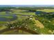 Aerial view showcasing home's waterfront setting and expansive landscape at 8541 Oyster Factory Rd, Edisto Island, SC 29438