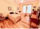 Bedroom with two twin beds, hardwood floors and ceiling fan at 8541 Oyster Factory Rd, Edisto Island, SC 29438