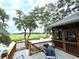 Relaxing deck overlooking scenic waterway, complete with grill and seating at 8541 Oyster Factory Rd, Edisto Island, SC 29438