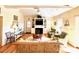 Bright living room with hardwood floors, fireplace, and vaulted ceiling at 8541 Oyster Factory Rd, Edisto Island, SC 29438