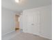 Bright bedroom with neutral walls and carpet, featuring a double door closet at 115 Duett Ct, Summerville, SC 29486