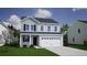 Two story home with two-car garage and light gray siding at 115 Duett Ct, Summerville, SC 29486