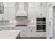 Modern kitchen with white cabinets, quartz countertops and gas cooktop at 1400 Dahlia Rd, Mount Pleasant, SC 29464