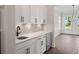 Modern wet bar with white cabinets, quartz countertop, and beverage cooler at 1400 Dahlia Rd, Mount Pleasant, SC 29464