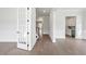 Open hallway with hardwood floors and French doors at 1400 Dahlia Rd, Mount Pleasant, SC 29464