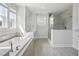 Luxurious bathroom with soaking tub, walk-in shower, and double vanity at 1400 Dahlia Rd, Mount Pleasant, SC 29464