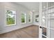 Sunlit office with hardwood floors and multiple windows at 1400 Dahlia Rd, Mount Pleasant, SC 29464