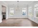 Bright dining room features hardwood floors, chandelier, and wainscoting at 1400 Dahlia Rd, Mount Pleasant, SC 29464