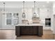 Kitchen island with dark wood cabinets and quartz countertop at 1400 Dahlia Rd, Mount Pleasant, SC 29464