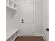 White laundry room with built-in shelves and bench at 1400 Dahlia Rd, Mount Pleasant, SC 29464