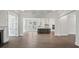 Open living room with hardwood floors and kitchen view at 1400 Dahlia Rd, Mount Pleasant, SC 29464
