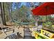 Relaxing patio with fire pit and hammock at 3610 Legareville Rd, Johns Island, SC 29455