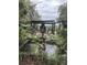 Serene water feature with swan statue near patio at 3610 Legareville Rd, Johns Island, SC 29455