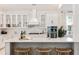 Modern kitchen with white cabinets, quartz countertops, and a large island at 130 Cantona Dr, Summerville, SC 29483