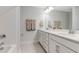 Bright bathroom with double vanity and shower/tub combo at 365 Wappoo Trace Ln, Summerville, SC 29486